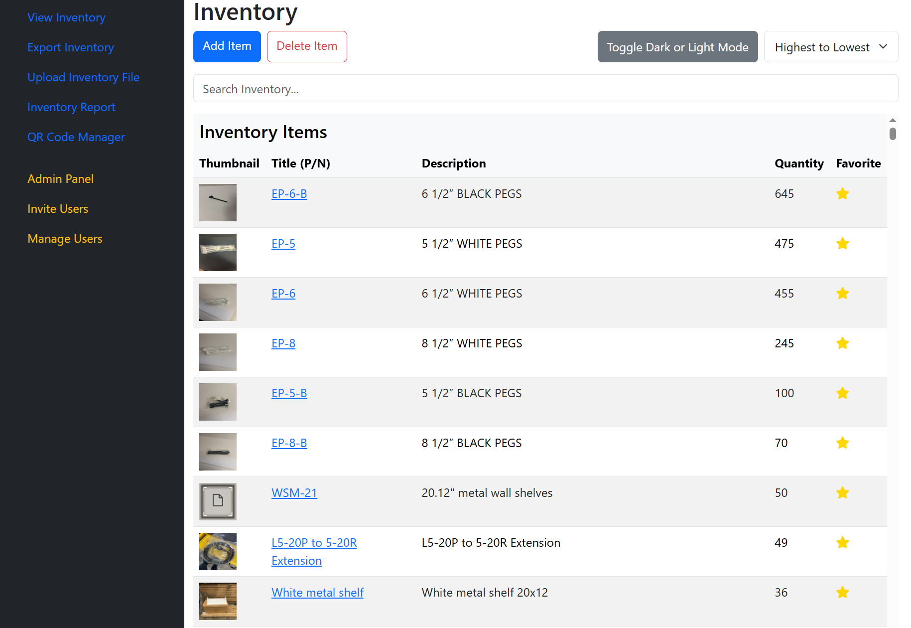 Person working on a laptop in a warehouse aisle